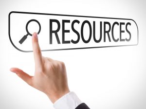 Image of a hand pointing to the word Resources