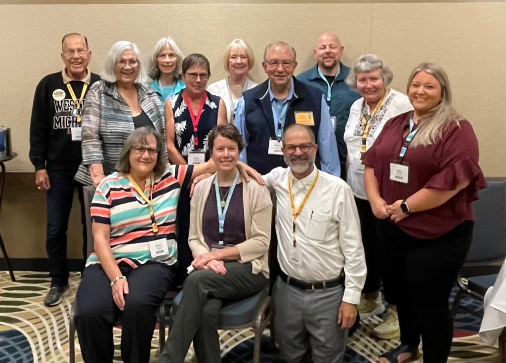 Past and current chairs of the AER Orientation & Mobility Division are pictured at the 2022 AER International Conference in St. Louis, Missouri. Front row: JoAnne Chalom, Raychel Callary, Chris Tabb, Maggie Winn. Back Row: Rod Kossick, Eileen Siffermann, Marjie Wood, Susan Langendonk, Laura Bozeman, Bill Wiener, Justin Kaiser, Nora Griffin-Shirley.

